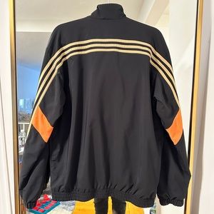 adidas Training 3 stripe track jacket in black and orange